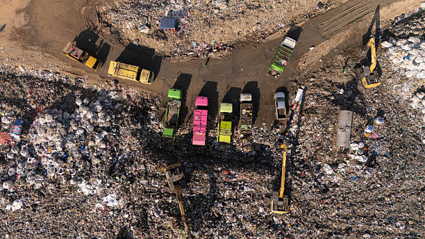 A waste management truck hauls another load of solid waste to a landfill site.