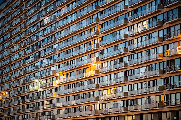 All Glass residential building at sunset - Population growth and demand for housing