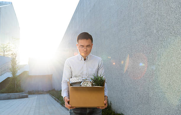 istock Unemployment man carrying box and leaving office 2228499537