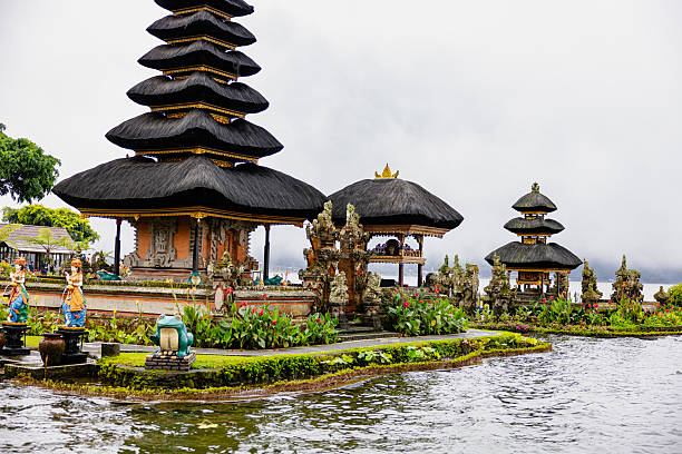 Pura ulun danu bratan temple with flower bed in foreground. Bali, Indonesia.