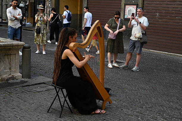Folk musician on the street of old Dubrovnik. Picturesque view on the old town (medieval Ragusa), Dalmatian Coast of Adriatic Sea, Croatia. World Heritage Sites UNESCO