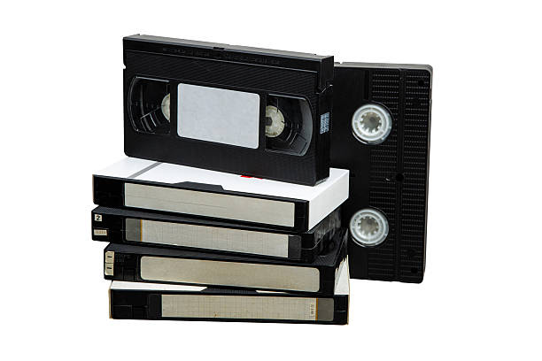 istock Stack of vintage VHS cassettes with blank white labels, arranged on white background, evoking analog nostalgia 2228504373