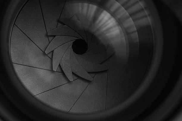 istock Macro camera lens,Photo Camera or Video lens close-up on black background, objective, concept of photographer camera man job, looking for a photographer, journalist, a videographer to work black and white 2228505148