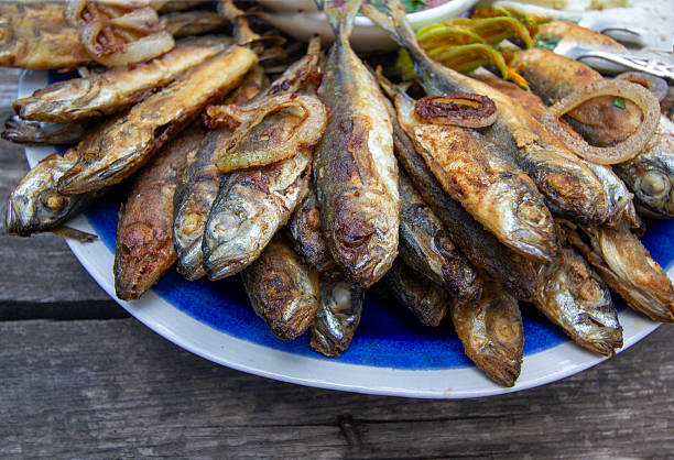 istock fried sea fish on a blue plate 2228507560