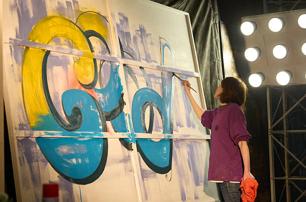 istock Woman Artist Create Graffiti Mural 2228508822