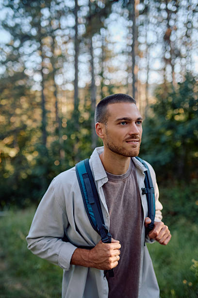 istock Young male hiker walking through forest enjoying nature during summer hike 2228509784
