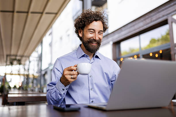 istock Entrepreneur Working Remotely with Coffee in Hand 2228511532