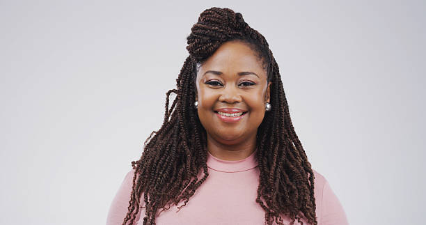 istock Portrait, happy and creative businesswoman in studio as confident copywriter. Worker, dreadlocks and smile for pride with African person, content writer or about us on white background space in Kenya 2228512352