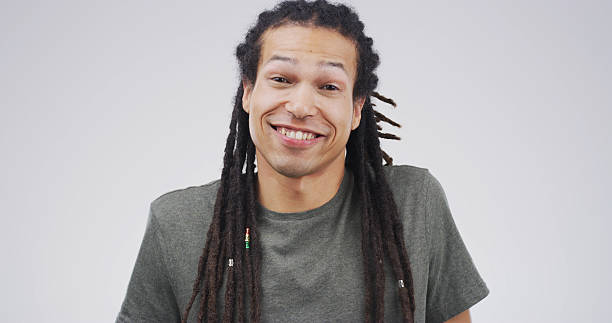 istock Portrait, happy and creative man in studio as confident copywriter for business. Worker, dreadlocks and smile for pride with African person or content writer on white background with space in Kenya 2228512361