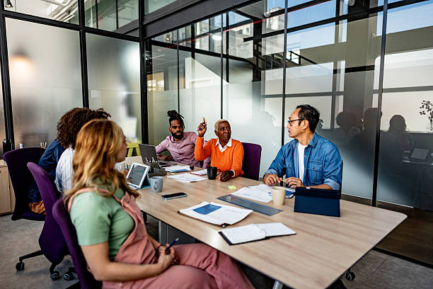istock Coworkers talking during meeting at office 2228514621