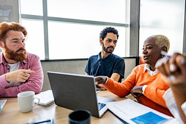 istock Coworkers talking during meeting at office 2228514773