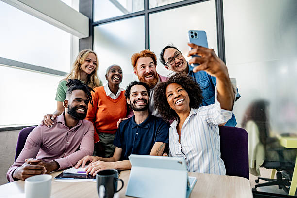 istock Coworkers taking a selfie at office 2228514883