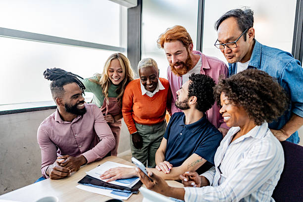 istock Happy coworkers talking after meeting at office 2228514885