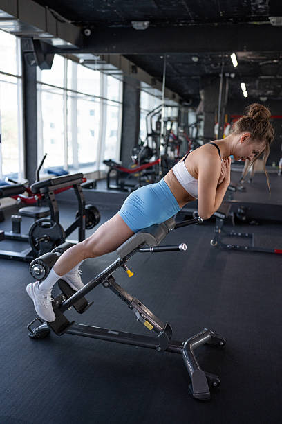 istock A woman is engaged in a workout session at a modern gym, focusing on her core strength training 2228515725