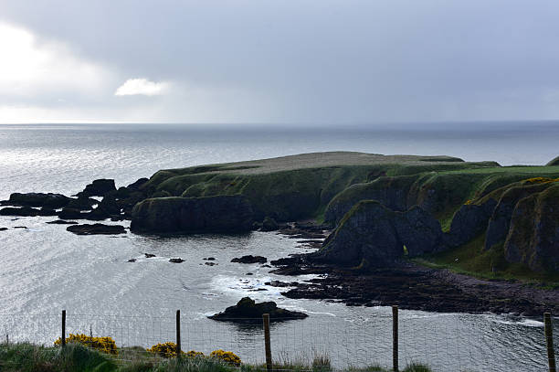 istock Dark Sea Cliffs Jutting Into the Ocean 2228515857