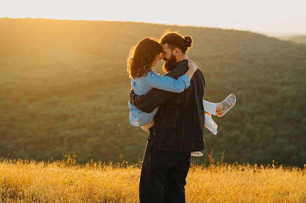 istock A Beautiful and Serene Meadow Setting with a Romantic Sunset Embrace Taking Place 2228518048