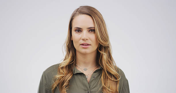 istock Education, woman or portrait with teacher in studio for learning occupation on a white background. Female person, serious educator or college tutor with wavy hair for teaching or development on space 2228518395