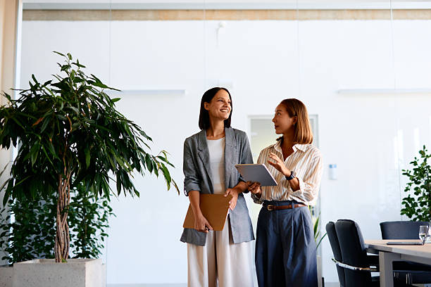 istock Two businesswomen discussing a project in a modern office 2228519856