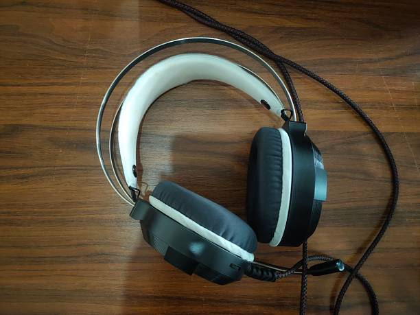 istock earphones on wooden table 2228520365