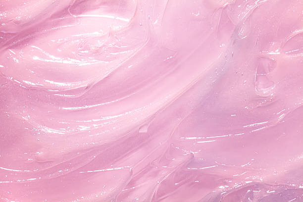 istock Texture of pink translucent beauty jelly balm background 2228520405