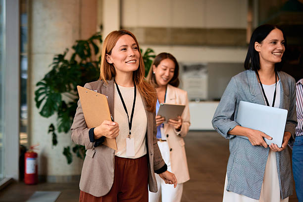 istock Businesswomen walking and smiling during a conference 2228522624