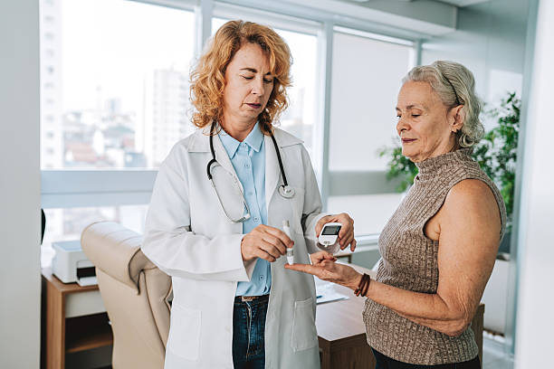 istock Doctor measuring senior patient's diabetes 2228523998