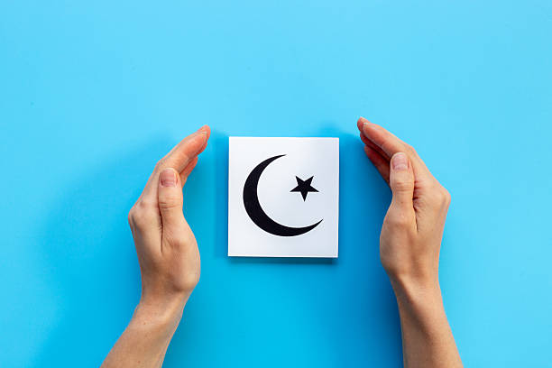 istock Hands holding Islam crescent symbol. World religious concept 2228524614