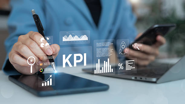 istock Close-up hand using a stylus and smartphone with a holographic KPI dashboard interface, showing charts, analytics, and performance metrics for business strategy tracking. 2228525688