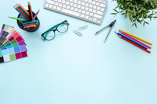istock Color paint swatches and decorator or designer tools for work. Desktop flat lay, top view 2228526950