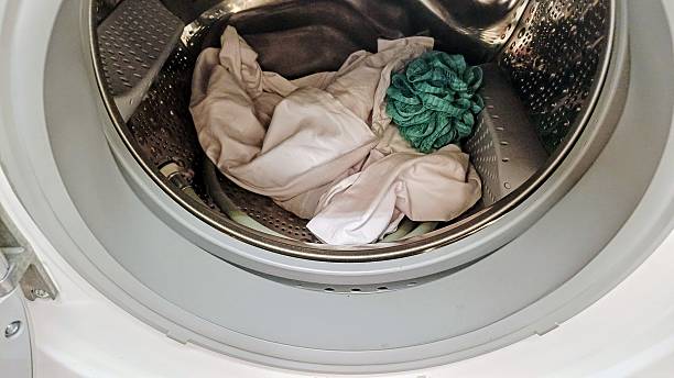 istock dirty laundry in the washing machine 2228531406