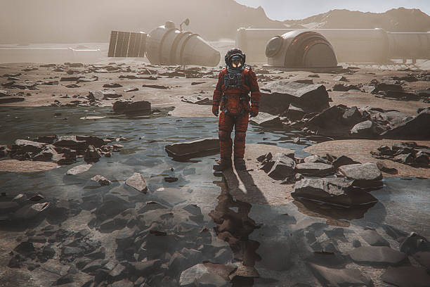 istock Astronaut on exo planet surface with liquid water 2228534789