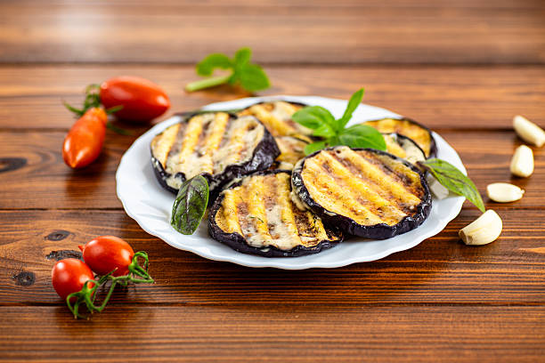 istock Appetizing eggplants with a golden crust and aromatic basil 2228534824
