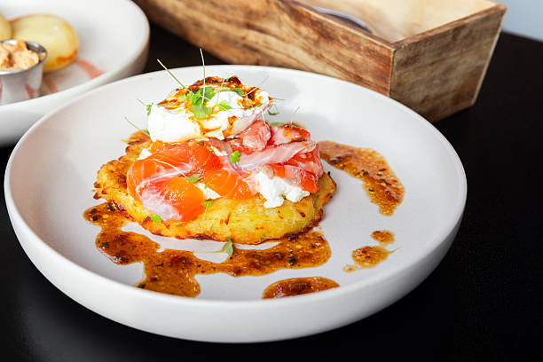 istock Delicious Breakfast Dish With Smoked Salmon and Poached Egg on Rosti 2228540996