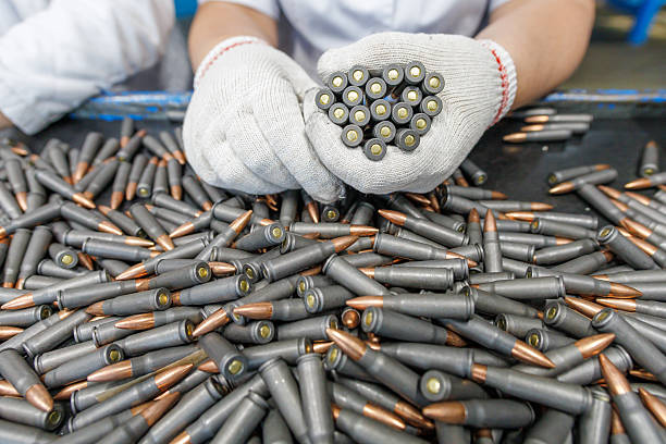 Production of big military plant. Cartridge or round - important component of firearm ammunition.