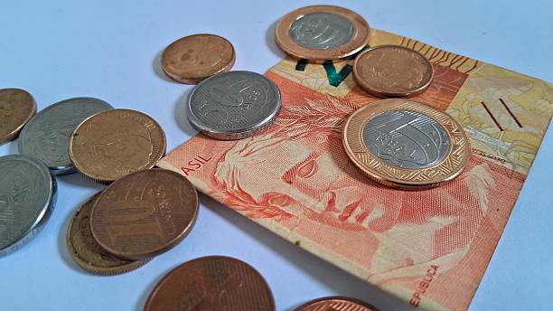 istock Coins and money on white background 2228543659