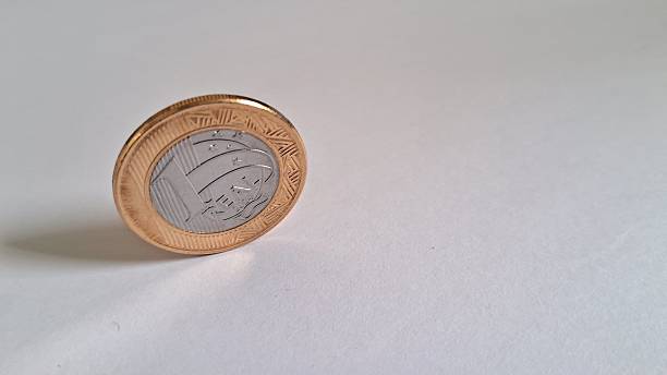 istock Brazilian real coins on white background 2228544061