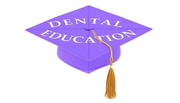 Top view of small mortarboard against pink background