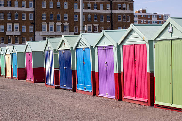 Colorful beach huts at Hove Beach, Brighton, UK.