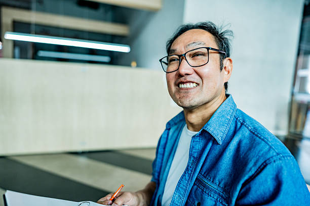 Mature businessman contemplating at office