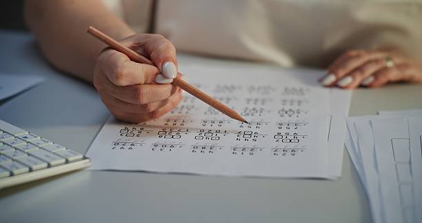 istock Close Up of Female Teacher Checking Math Homework of Students, Grading Mathematical Tests 2228545760