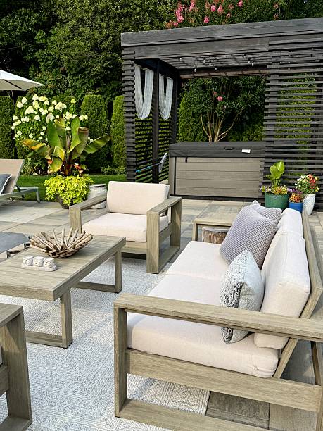 istock Beautiful, luxury, modern backyard lounge area. Umbrella, sofa, lounge chairs table poolside. Hotel resort feel. Seating and tanning sundeck by gray stone pavers. Inspired by Tulum, Mexico. High end. 2228545850