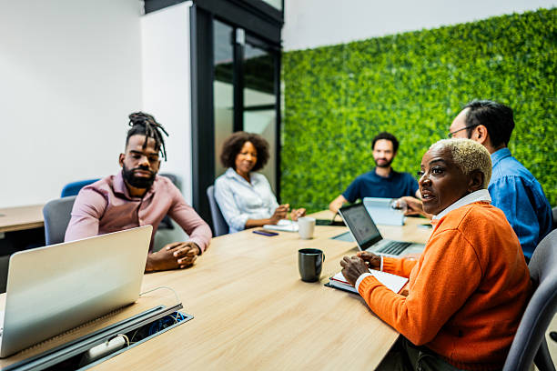istock Coworkers talking during meeting at office 2228546450