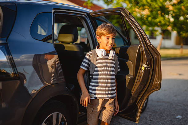 istock Elementary school student exiting car in the afternoon 2228547406