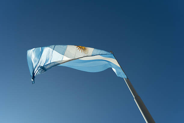 istock Argentinian flag waving in the wind against a clear blue sky 2228549716