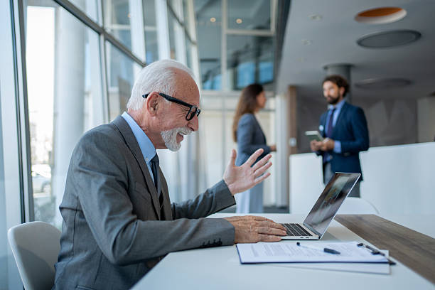 istock Senior businessman making a video call in the office 2228551032