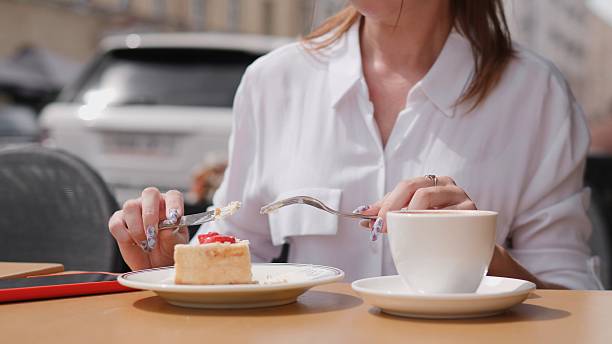 istock Indulging in delightful dessert and rich coffee while relaxing at a cozy cafe setting 2228551185