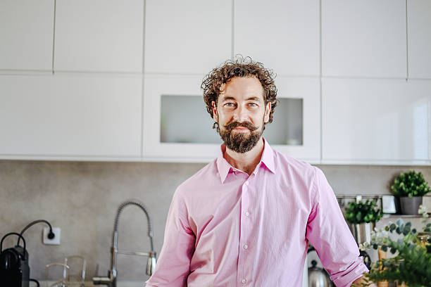 istock Portrait of confident entrepreneur smiling in modern kitchen 2228551254