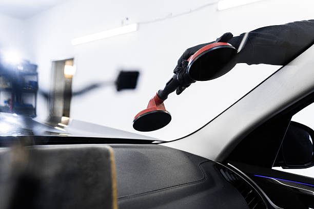istock Windshield technicians rely on vacuum lifters for glass removal. Windshield removal and installation using suction lifters. Windshield replacement using lifting tools that grip glass securely. 2228552087