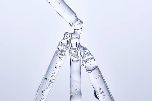 istock Four different face serum pipettes on a neutral background. 2228553986