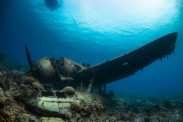 Image with a dive boat and the navy floatplane, an Aichi E13A1-1 or Jake type reconnaissance seaplane. It's one of the most intact wrecks in Micronesia, resting at 45 feet (15m) in Koror, Palau - Micronesia